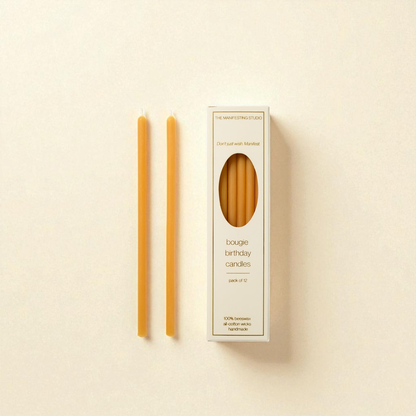 The Manifesting Studio Honey Gold beeswax birthday candles, luxury 6-inch tapers designed for intentional birthday celebrations."