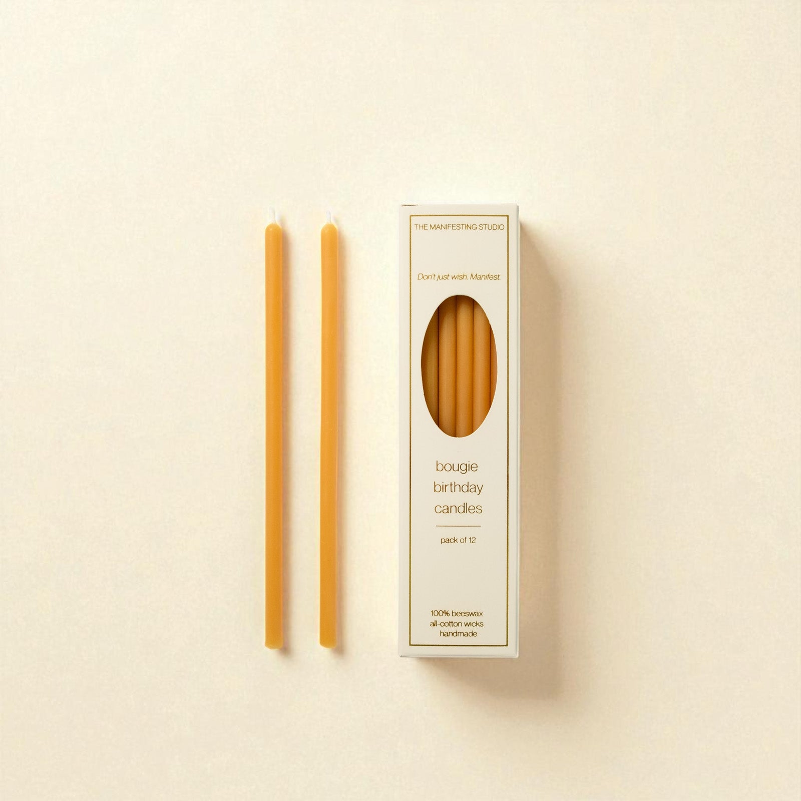 The Manifesting Studio Honey Gold beeswax birthday candles, luxury 6-inch tapers designed for intentional birthday celebrations."
