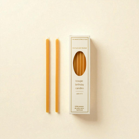 The Manifesting Studio Honey Gold beeswax birthday candles, luxury 6-inch tapers designed for intentional birthday celebrations."