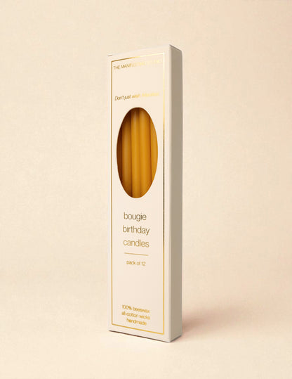 The Manifesting Studio Bougie Birthday Candles retail box, luxury packaging with gold foil details, shelf-ready for boutiques.