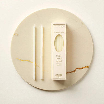 "The Manifesting Studio Ivory beeswax birthday candles, 6-inch tapers in gift-ready box for manifesting rituals."